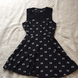 Black dress with white bows